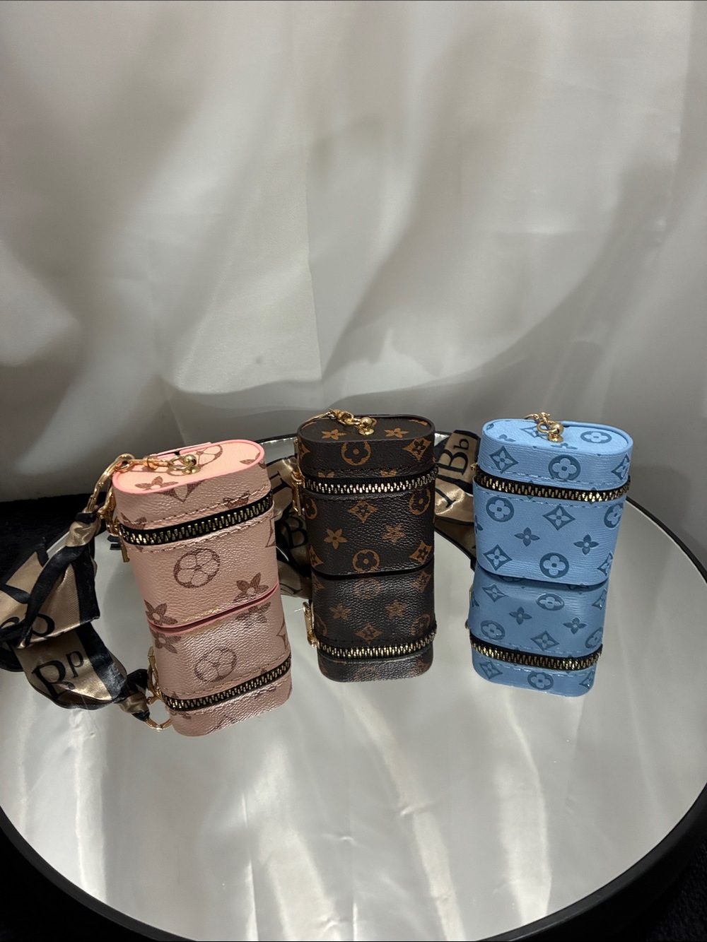 Fashionable purse charms you get three- Pink, Brown, Blue